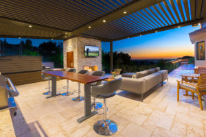 "outdoor living patio tv and louvered roof"