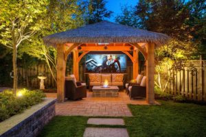 "outdoor living with tiki gazebo and outdoor tv"